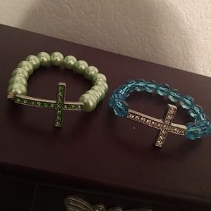 2 beaded cross bracelets.